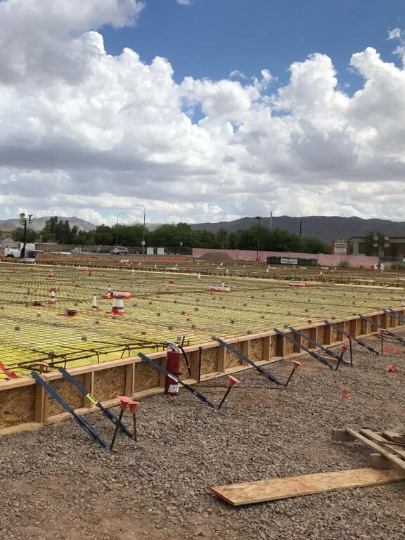 commercial concrete slab being carefully boxed and reinforced with fiberglass on a large scale mall construction project in Glendale Arizona