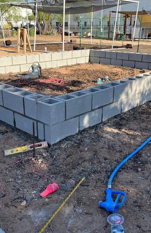 commercial concrete slab being carefully boxed and reinforced with fiberglass on a large scale mall construction project in Glendale Arizona